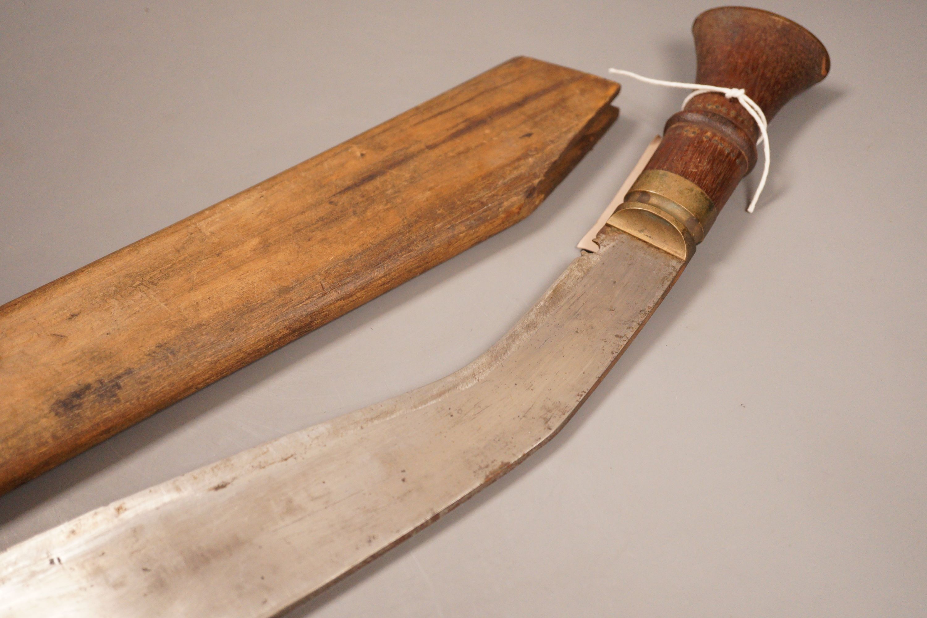A kukri with hardwood handle and sheath
